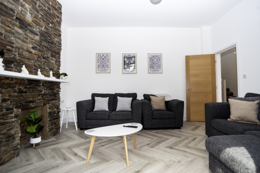 Bright & Spacious Living Room - Airy space with plenty of comfortable seating, a smart TV, coffee table and beautiful modern décor