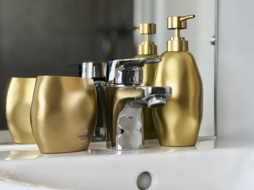 Modern bathroom with fresh towels and essential amenities.
