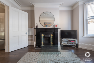 Stylish lounge with original fire place and smart TV