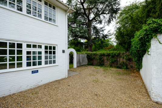 Free private parking area for guests' cars outside the front entrance to the property.