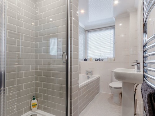 Bright bathroom with separate shower enclosure