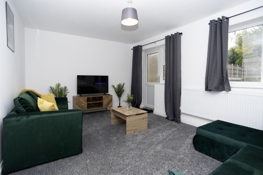 Spacious living room with two beautiful sofas — one doubling as a comfy sofa bed - plus a Full HD Smart TV and super-fast WiFi for relaxing, streaming or working with ease.