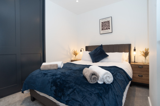 A comfortable third double bedroom with super-comfy beds and mattresses, hotel-quality linen and towels, wardrobe with hangers, and complimentary shower gel, shampoo, conditioner, tea, coffee and sugar - offering the perfect home-from-home stay.