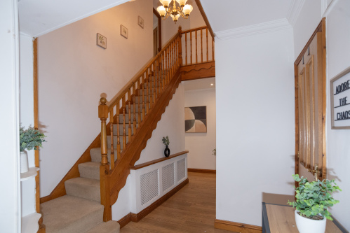 Welcoming entryway and staircase, creating a warm first impression on arrival.