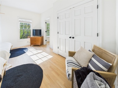 Crisp white tones and natural light make this bedroom an instant mood-lifter.