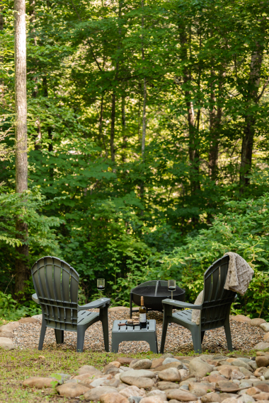 Breathe in the fresh mountain air, enjoy nature, and unwind at the private fire pit by the treehouse.