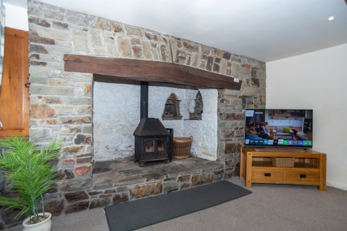 The original stone inglenook is the heart of the farmhouse, much as it would have looked 300 years ago