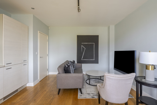 Experience refined comfort in this beautifully designed living room, where sophisticated décor meets effortless elegance. Flooded with natural light, the space features plush seating, stylish accents, and a statement centrepiece that elevates every moment. Perfect for relaxing or entertaining, this room delivers luxury living at its finest.