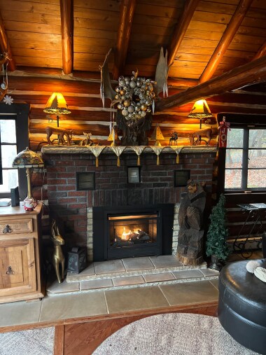 Living room fireplace with holiday decor