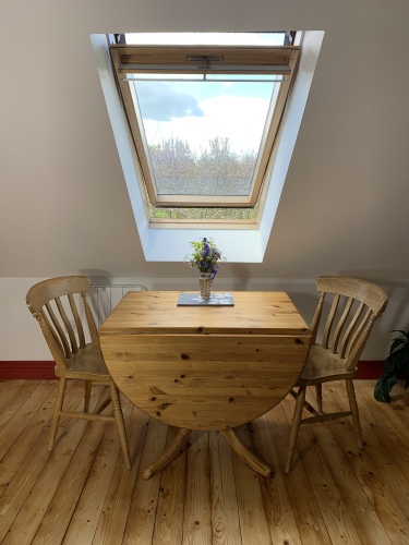 Dining area with extendable table (seats 4) with views over the orchard