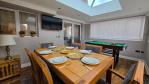 The conservatory is where memories are made! Dine, play pool, or watch the big game – all in one stunning garden-view space.