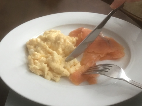 Breakfast of smoked salmon and scrambled eggs