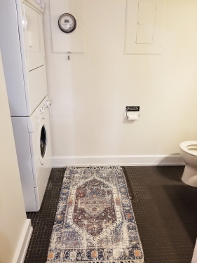Downstairs bathroom with washer and dryer
