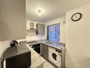 Kitchen: Showing washing machine