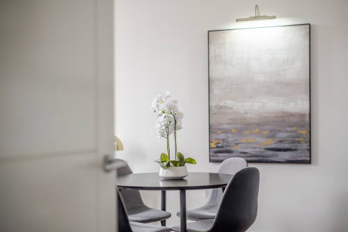 An elegant dining area designed for memorable gatherings, featuring a statement dining table, sophisticated seating, and ambient lighting. This refined space blends style and comfort, perfect for both intimate meals and grand entertaining.