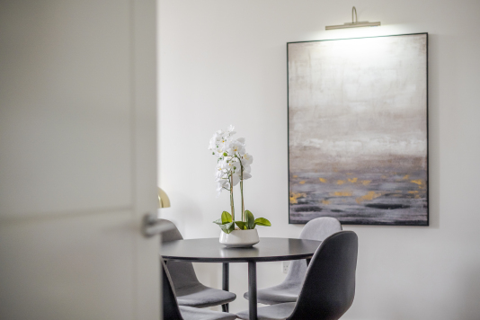 An elegant dining area designed for memorable gatherings, featuring a statement dining table, sophisticated seating, and ambient lighting. This refined space blends style and comfort, perfect for both intimate meals and grand entertaining.