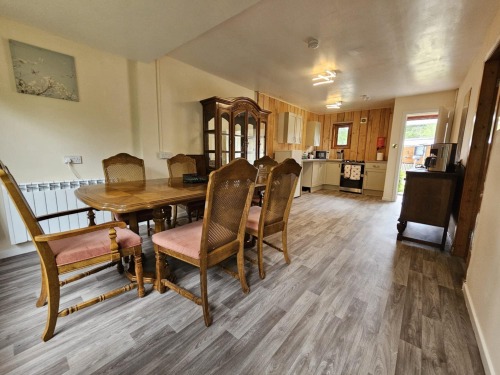 Dining area and kitchen towards front door