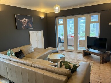 Lounge/Diner with table to sit 6 people, and large comfortable sofa