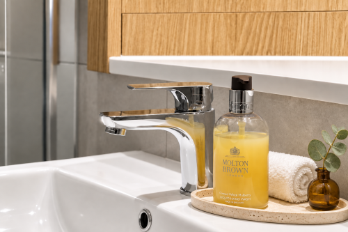 Walk-in shower
Stylish walk-in shower finished with elegant marble-effect tiles, a rainfall shower and polished chrome fittings for a luxurious, hotel-inspired feel.