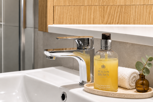 Walk-in shower
Stylish walk-in shower finished with elegant marble-effect tiles, a rainfall shower and polished chrome fittings for a luxurious, hotel-inspired feel.