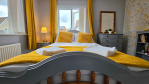 All the comforts of a hotel suite, in the heart of a family home. En-suite, storage, and a good book waiting for you.