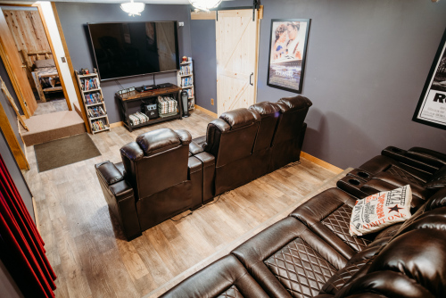 Lower level movie room with 100+ movies to choose from