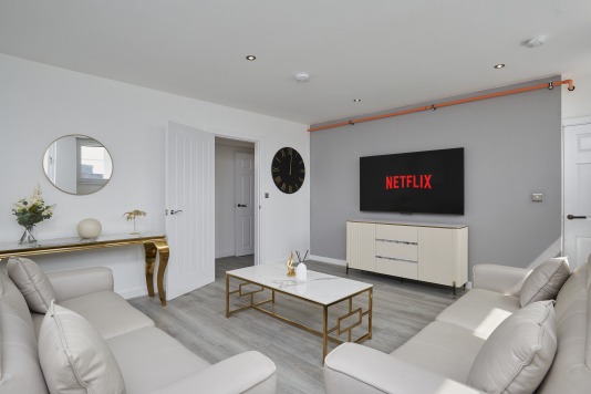 A bright and inviting living space designed for comfort and relaxation.