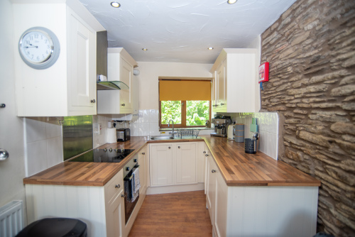 Fully equipped for self-catering stays, the stylish kitchen features everything needed for preparing family meals, morning coffees and holiday feasts.
