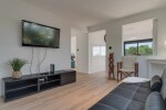 First Floor Apartment with a sofa bed for 1 adult and a television.