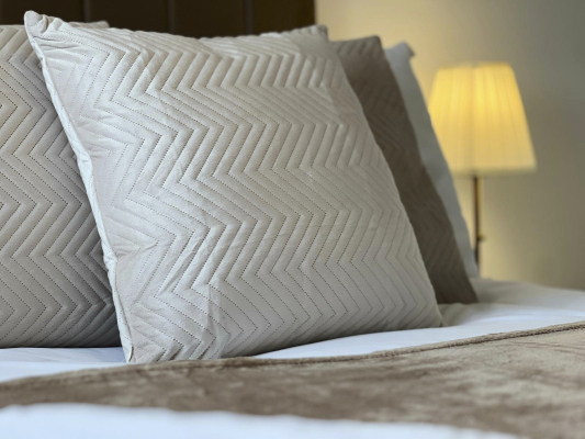 Comfortable bedroom featuring premium bedding for a restful night's sleep.