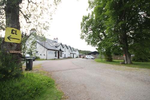 The main building, the entrance to Mountain View is to the left, park the car in the car park opposite and walk round, open the gate and access the flat front door