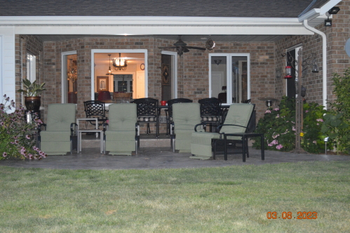 Back porch Dining area and lounge chairs