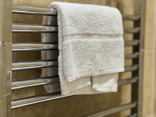 Fresh towels and essential toiletries provided.