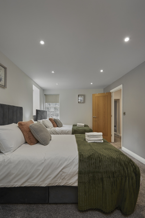 Relax and unwind in a spacious and comfortable bedroom.