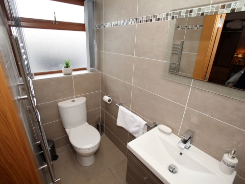 Fully tiled larger double room bathroom