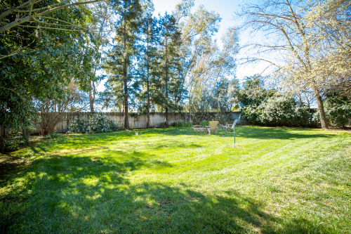 Large fenced in grass yard and patio for outdoor enjoyment