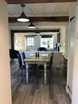 View of dining room towards living area and front door