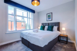 Comfortable bedroom with a king-size zip and link bed that can be separated into two singles upon request.