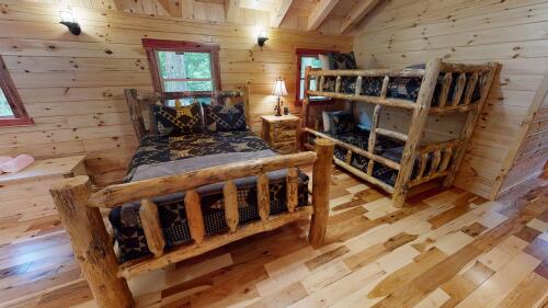 Loft Queen bed and set of twin bunks. OPEN to below