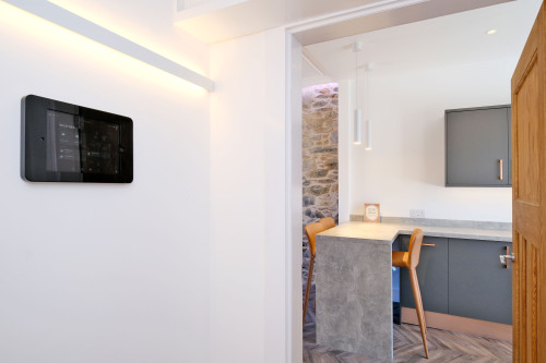 Centrally mounted tablet for you to explore your smart home in more detail if you - or pass it by if the home is taking care of you just as it is