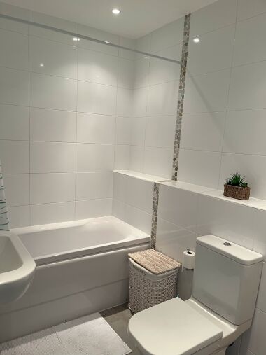 Bathroom with sink, toilet, bath & overhead shower