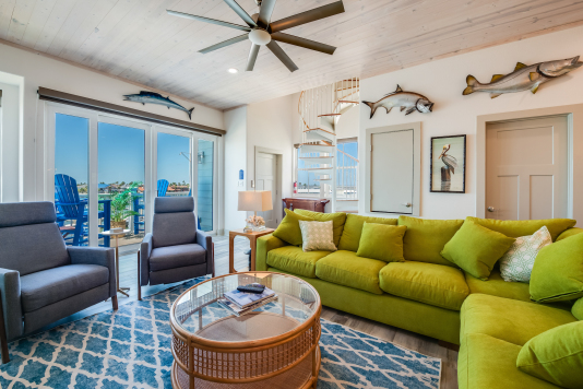 Living area has balcony with motorized shades for light control