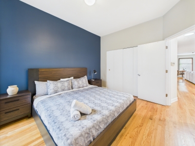 The King Suite — a symphony of navy, natural light, and refined comfort.