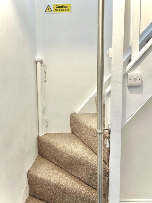 Bedroom 4 - Stairs leading to loft bedroom with stair gate at the bottom