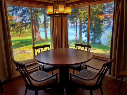 Close up dinning room with great views.  Table has leaves and expands. 