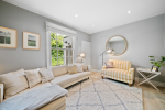 Separate sitting room with 65 inch TV, and porch to front door