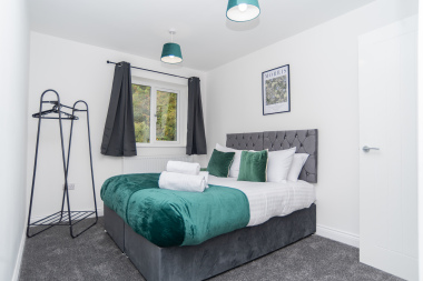 Bedroom with two single beds that convert into one king - a flexible zip-link setup perfect for any group. Just let us know your preferred layout before arrival.