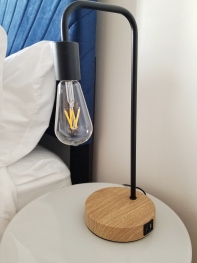 Bedroom lamps have USB charging ports for guest convenience