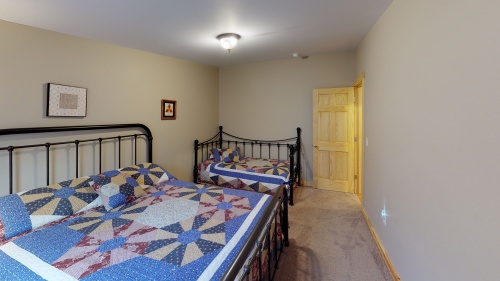 Bedroom 4 comfortably accommodates 2-4  guests in its Queen and Twin/Trundle bed