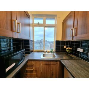 This photo represent the kitchen of the property. 
